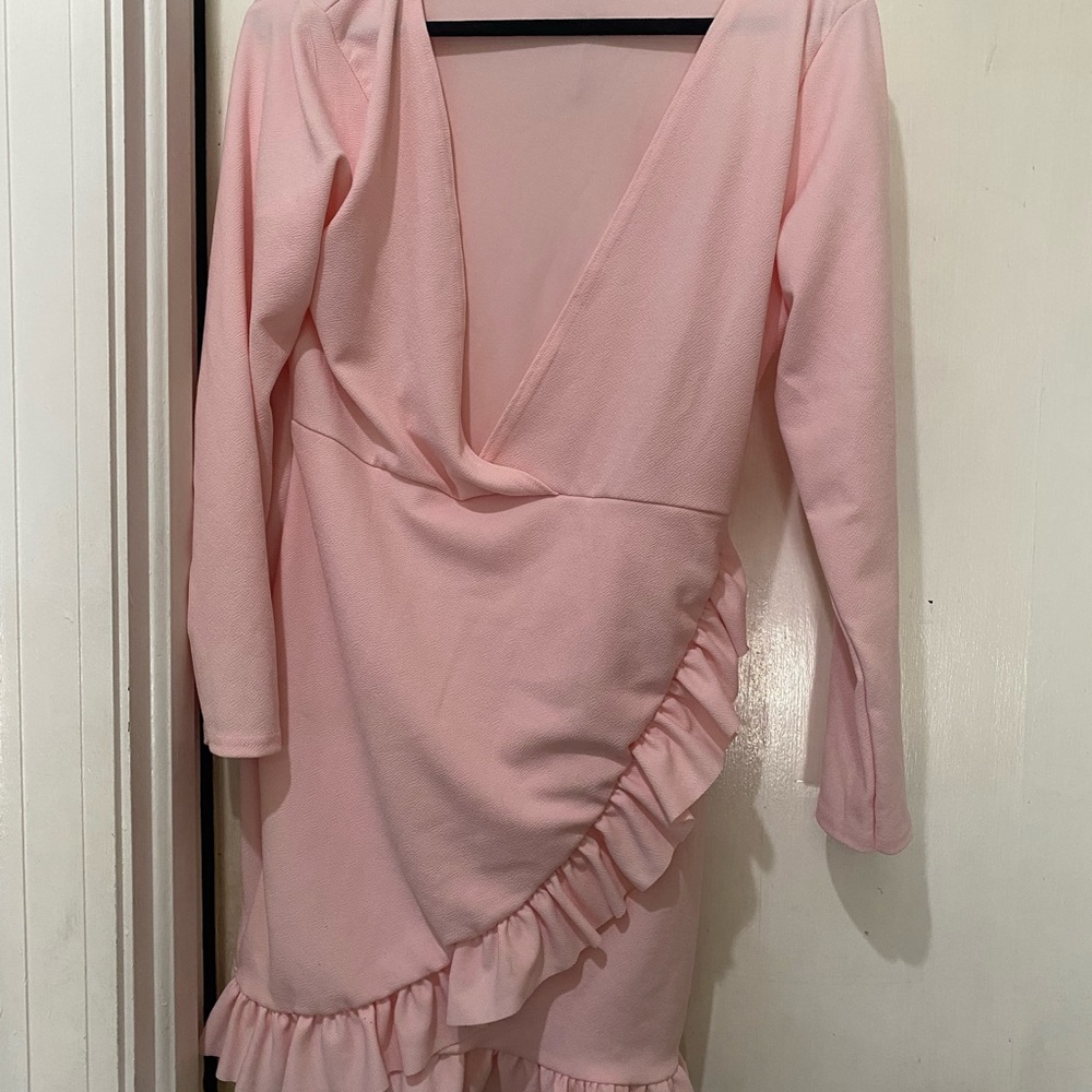 Pink dress with long sleeves and ruffled bottom